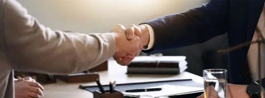 Two people shaking hands - Darryl A. Stallworth Law Office - Should I Hire An Attorney If I Think I’m Guilty