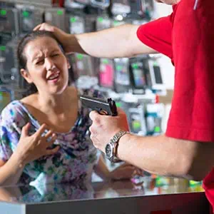 A man threatening a woman with a gun - Darryl A. Stallworth Law Office