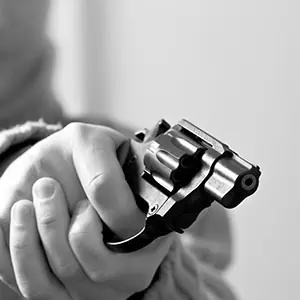A gun in hands - Darryl A. Stallworth Law Office